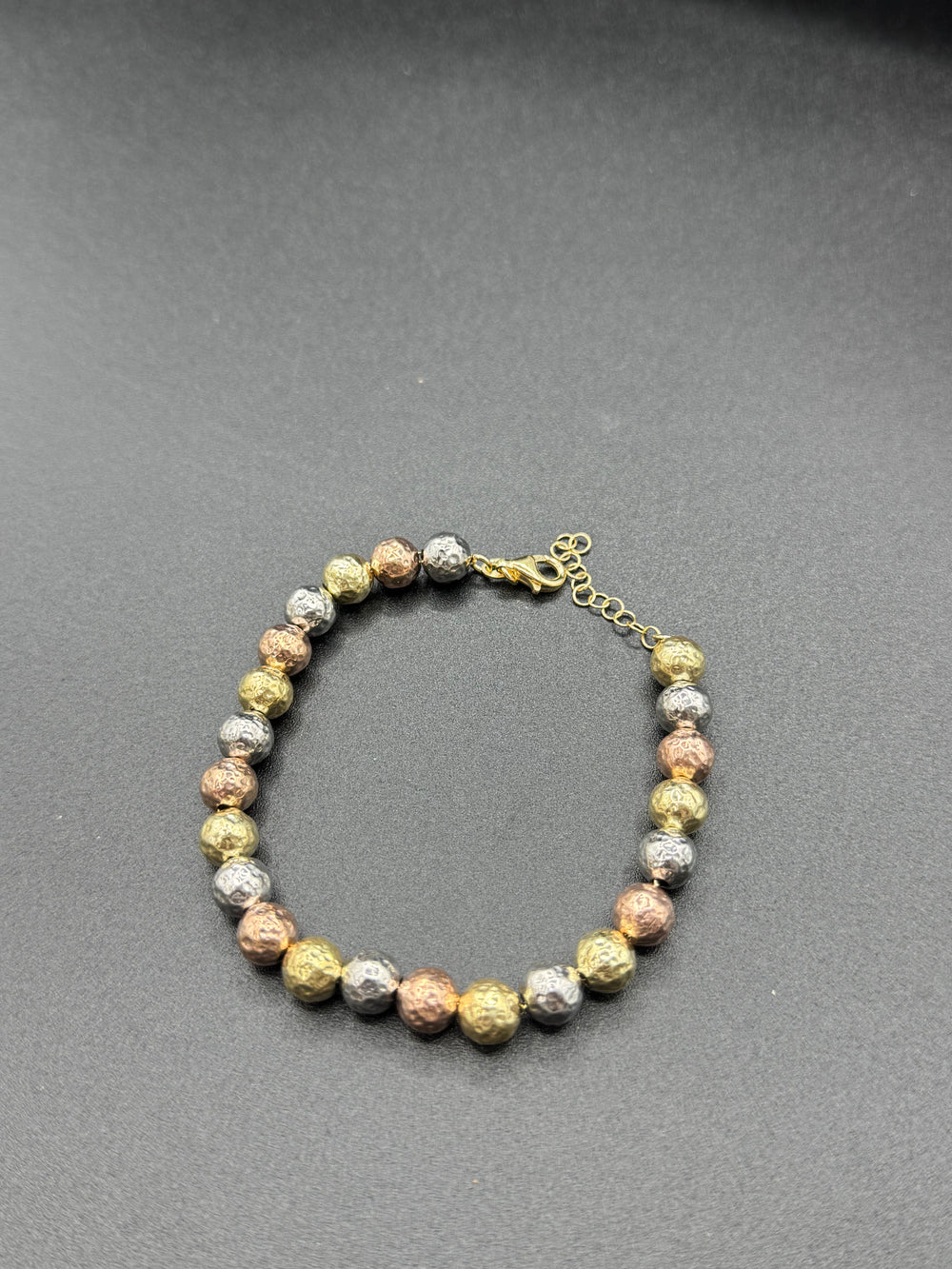 Pulsera tricolor de plata.